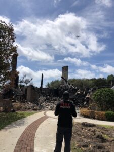 Kevin Hays Fire Consulting forensic team member  Daniel uses a drone to survey the scene of a large residential fire